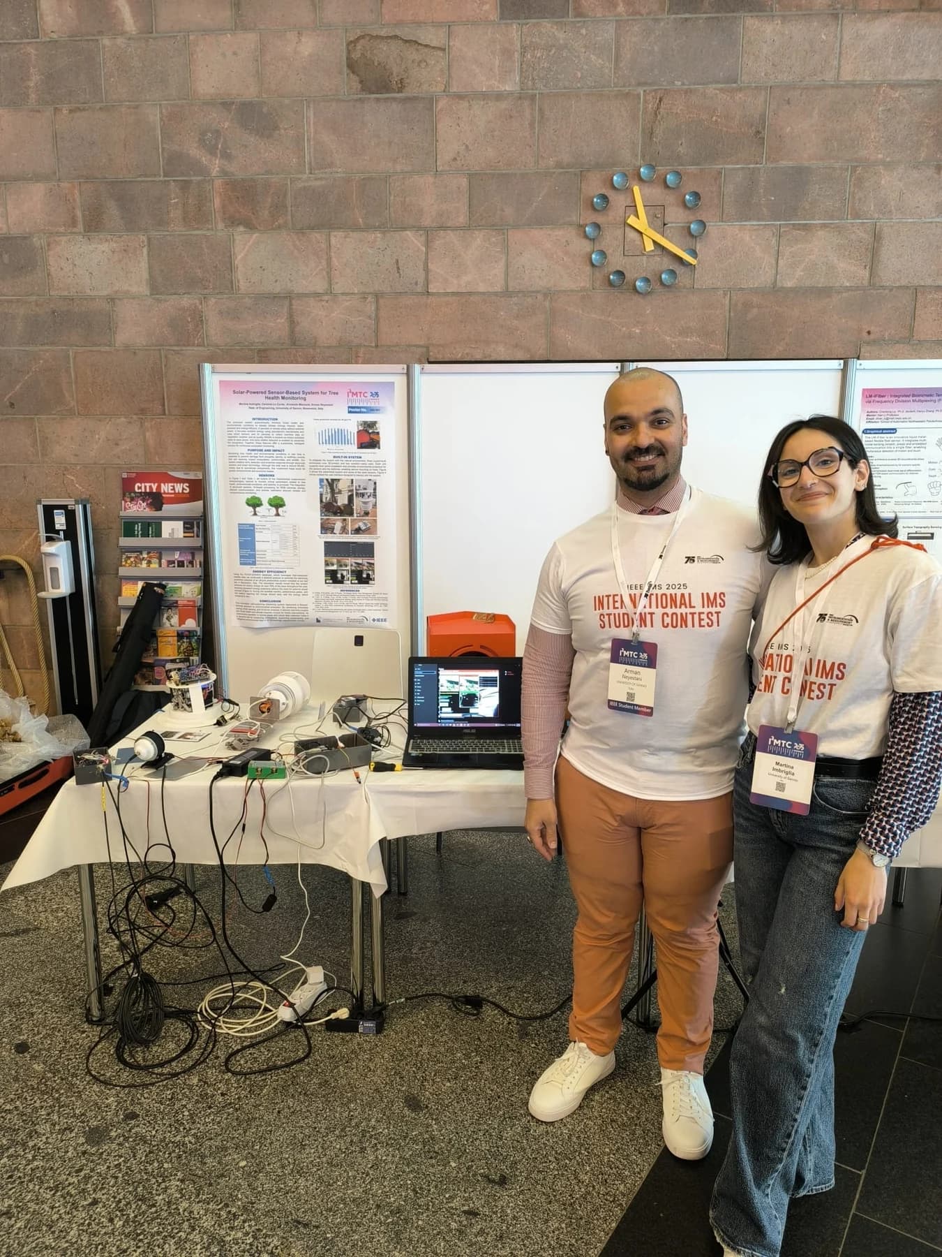 Arman Neyestani and a colleague at their student contest demonstration booth.